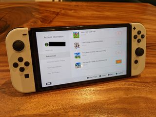 eショップのアカウントプロフィールからゲームを再ダウンロードする方法のスクリーンショットを表示しているデスクのスイッチをオンにします。